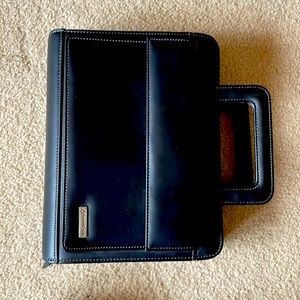 Black faux leather Franklin Covey planner with handles